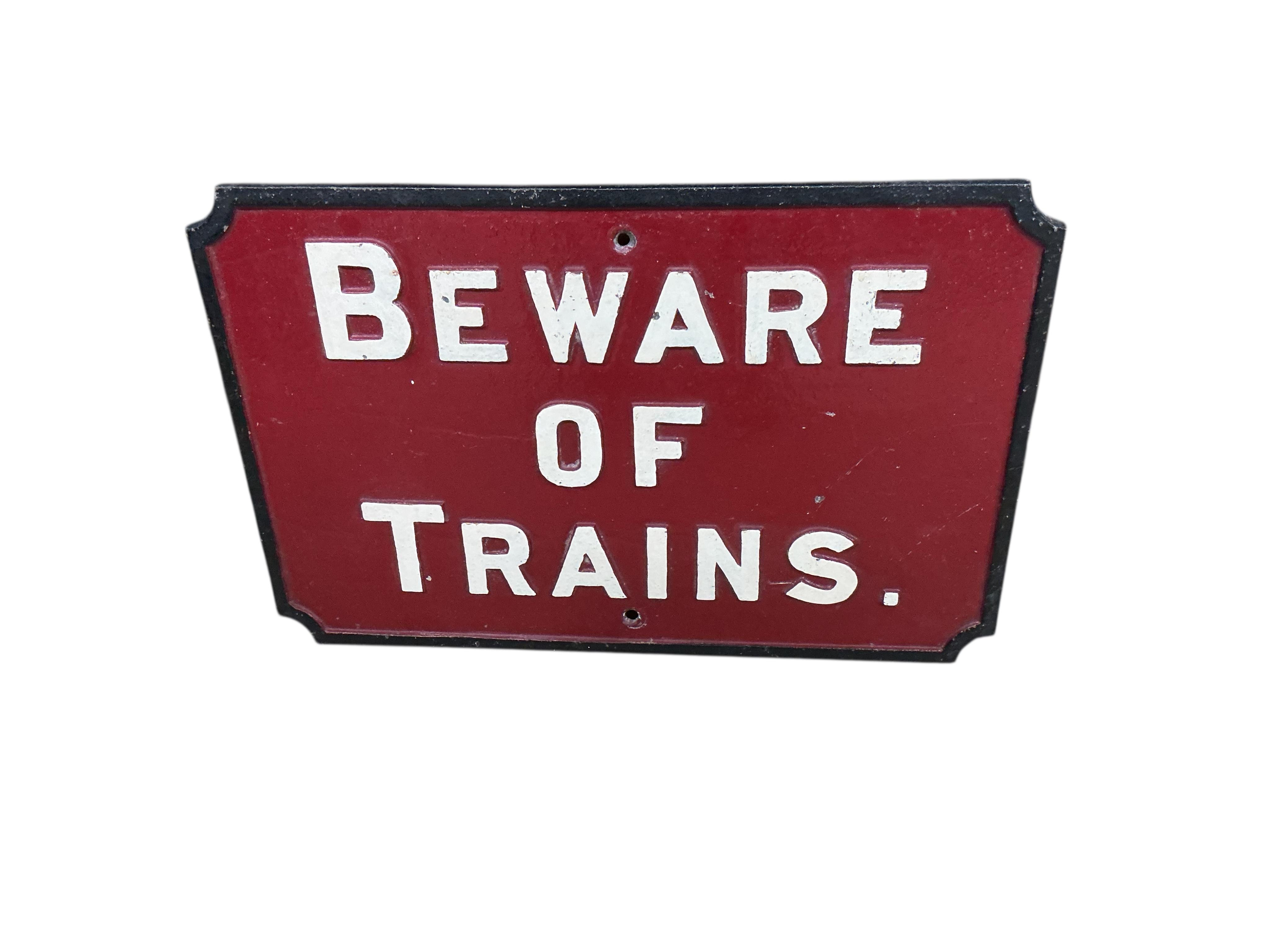 A rectangular 'Rinso' enamelled advertising sign and a cast iron sign 'Beware of Trains', larger width 61cm, height 46cm